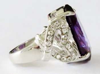 Chunky silver tone fashion ring with big purple stone and clear stone hearts (Size 10)