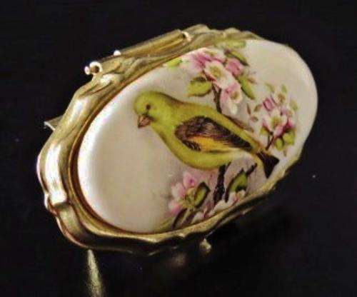 Vintage gold tone and porcelain mirrored lipstick holder decorated with a bird 