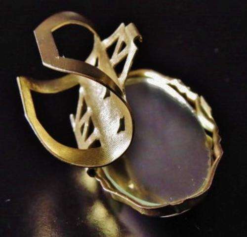 Vintage gold tone and porcelain mirrored lipstick holder decorated with a bird 