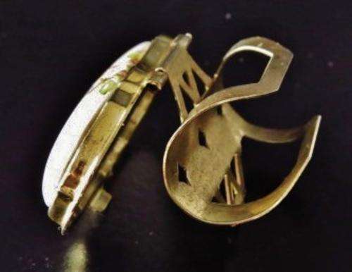 Vintage gold tone and porcelain mirrored lipstick holder decorated with a bird 