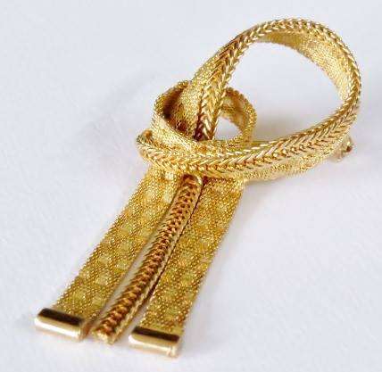 Gold tone mesh ribbon brooch pin