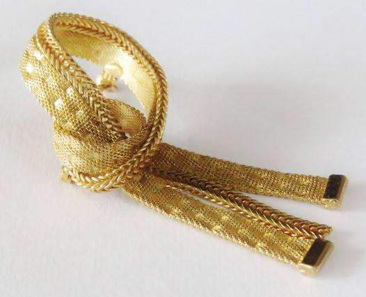 Gold tone mesh ribbon brooch pin