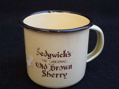 Vintage tin cup embossed with Sedgwick's the original Old Brown Sherry