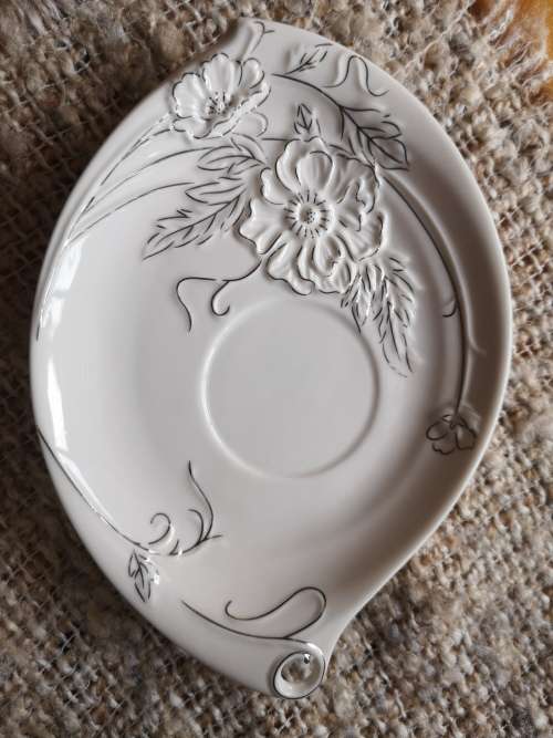 Highly Collectable Porcelain Teacup and Saucer with embossed detail and silver finishing