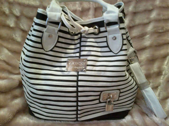 BRAND NEW!!!! WHITE DRAWSTRING BAG- A MUST HAVE!!!!!