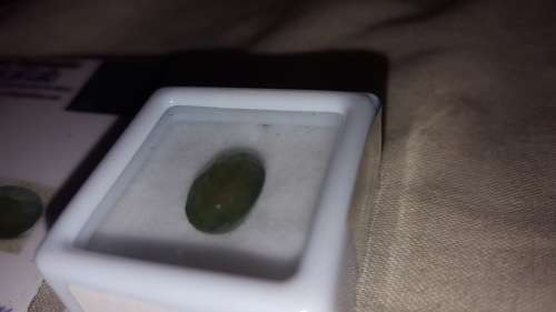 EMERALD in sealed container and certificate.