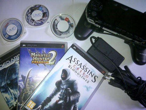 PSP + 3 Games + Extra Battery/Handle accessory.