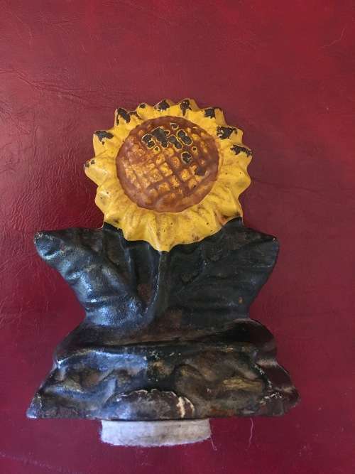 Vintage Sunflower Cast Iron Door Stop with Loads of Character