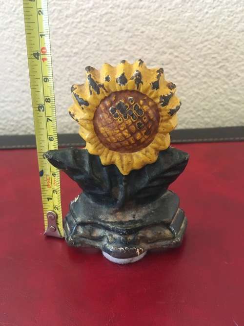 Vintage Sunflower Cast Iron Door Stop with Loads of Character