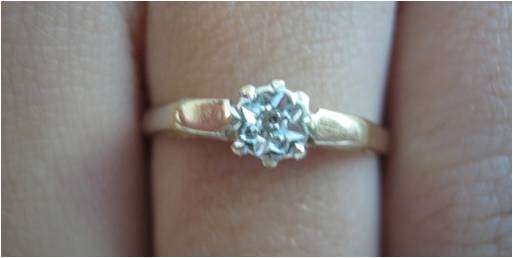 GENUINE 9CT GOLD WITH SMALL DIAMOND IN A VERY CLEVER SETTING.
