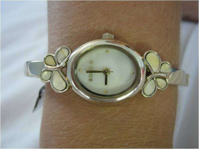 VERY DAINTY LADIES/GIRLS WATCH WITH ENAMEL BUTTERFLY ON SIDES.