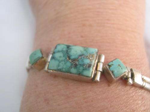 SILVER TONED BRACELET WITH TURQUOISE STONES