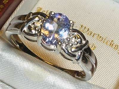 WHITE GOLD WITH TANZANITE AND FLANKED BY TINY DIAMOND ON EITHER SIDE OF SHANK - SIZE UK N / UK 7
