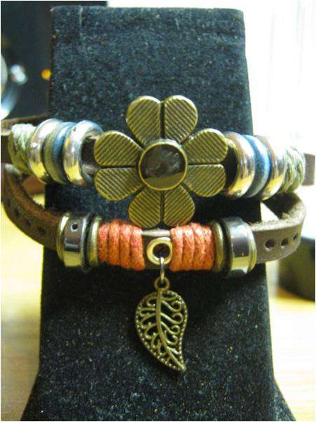 ETHNIC LEATHER WITH FLOWER AND LEAF CHARMS AND BEADS