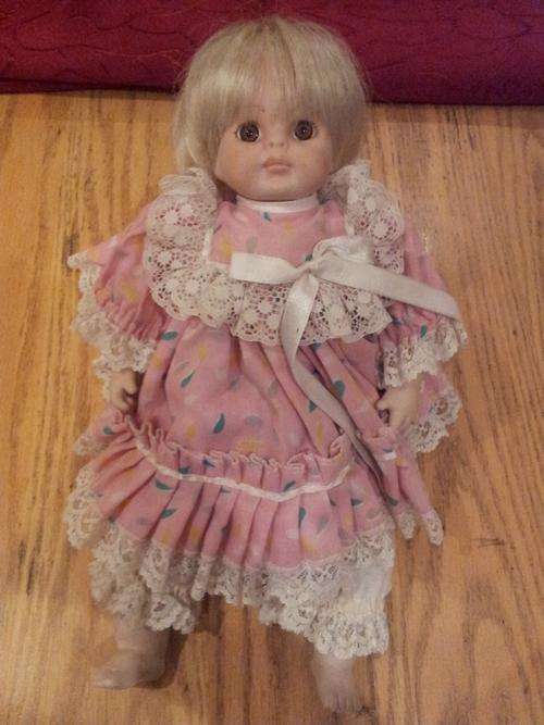 OLDER BABY DOLL WITH PORCELAIN HEAD AND LIMBS
