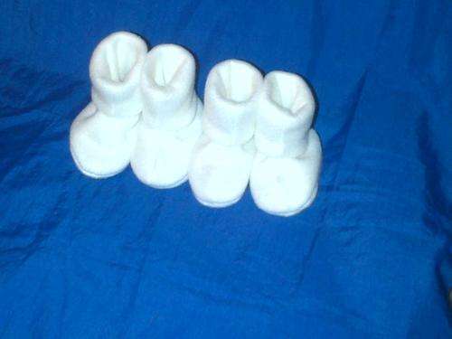White newborn baby boots 0-3 months. 2 pairs per pack
