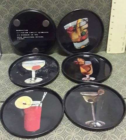 Tin coasters with cocktail recipes on the back