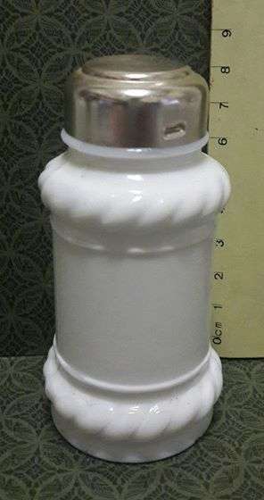 Small milk glass bottle with cap