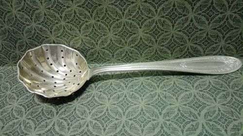 Vintage pierced sugar spoon