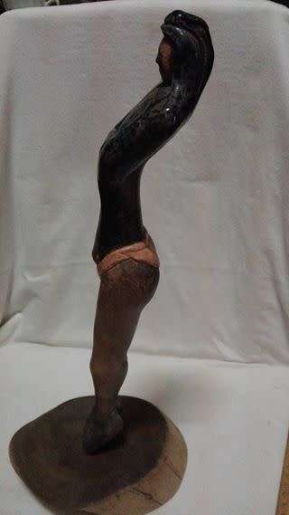 Tall ceramic sculpted  figurine on wooden stand LOOK!!
