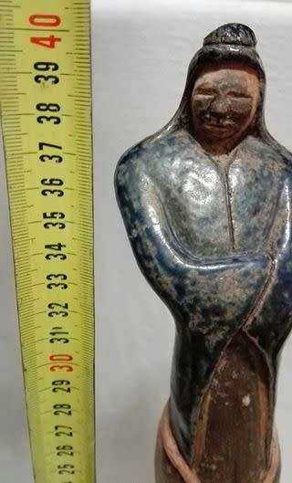 Tall ceramic sculpted  figurine on wooden stand LOOK!!