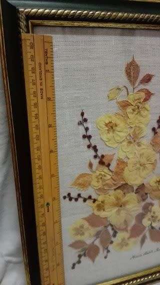 Vintage pressed flower arrangement behind glass!