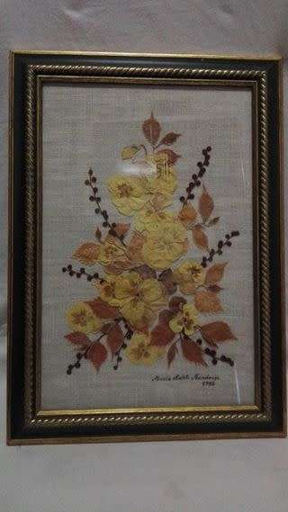 Vintage pressed flower arrangement behind glass!