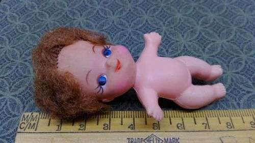 Pretty small doll made in Hong Kong!