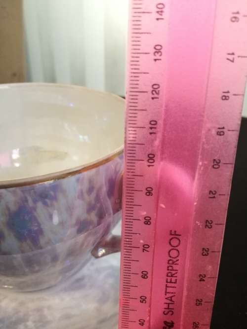 Over-sized Lustreware teacup and saucer