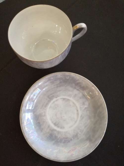 Over-sized Lustreware teacup and saucer
