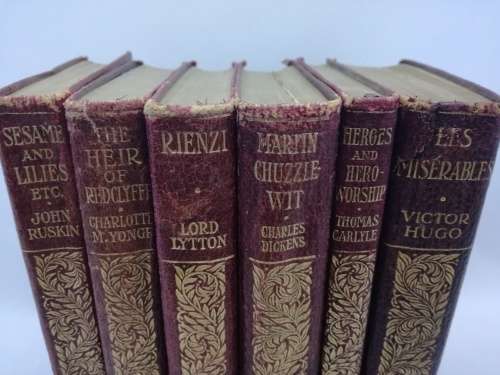 Leather bound books Author names written in gilt on front cover x 6