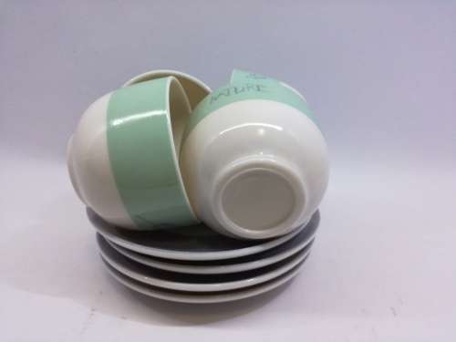 Small cup and saucers in milk glass
