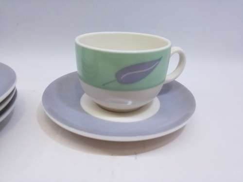 Small cup and saucers in milk glass