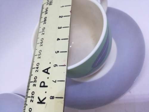 Small cup and saucers in milk glass