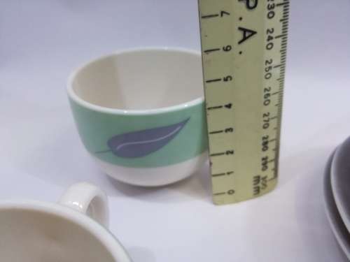 Small cup and saucers in milk glass