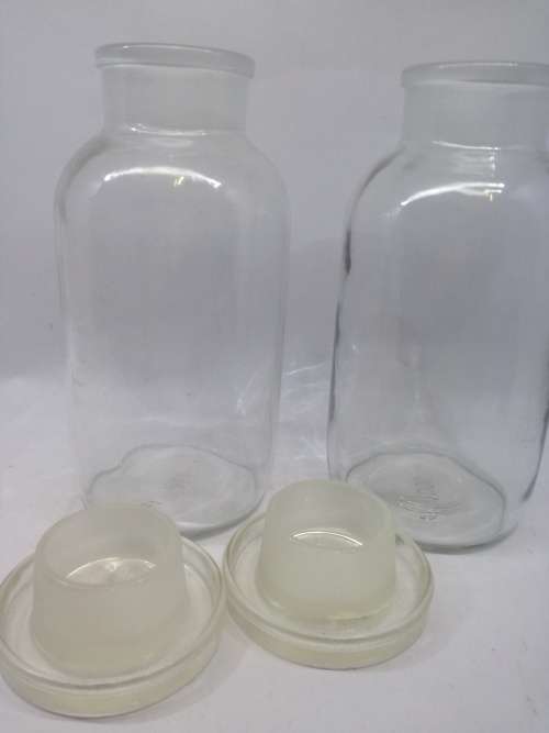 2 Vintage bottles with glass stoppers