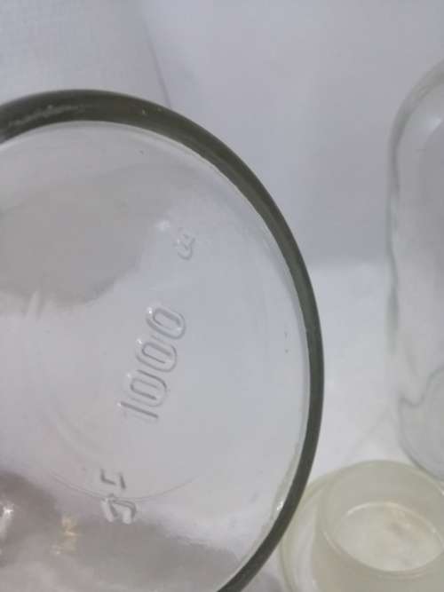 2 Vintage bottles with glass stoppers