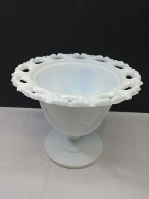 Footed milk glass vase
