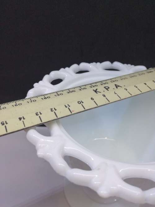 Footed milk glass vase