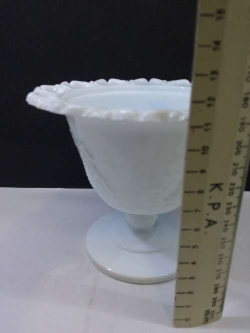 Footed milk glass vase