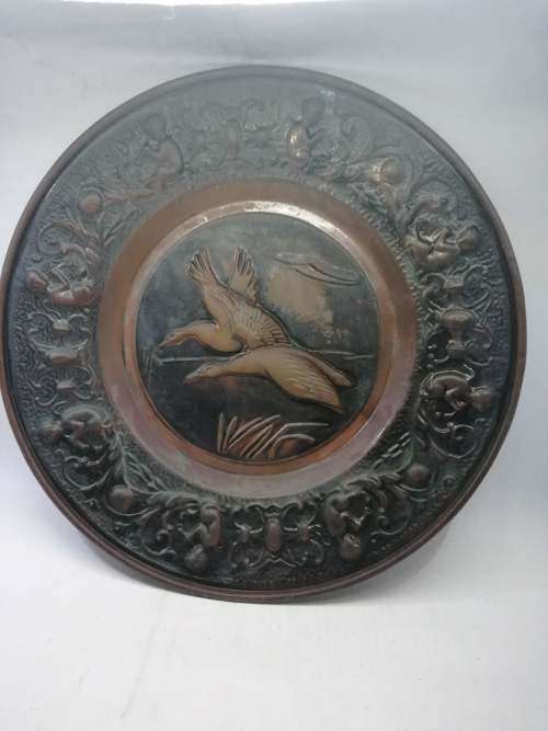Big copper wall plate - embossed with geese and angels/cupids