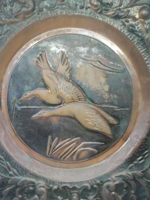 Big copper wall plate - embossed with geese and angels/cupids