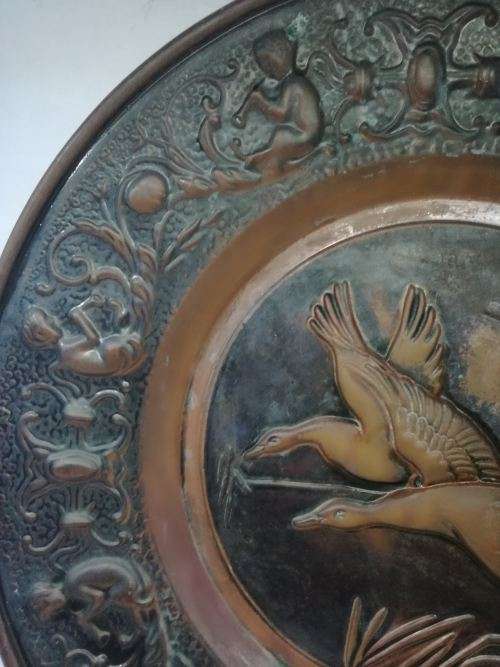 Big copper wall plate - embossed with geese and angels/cupids