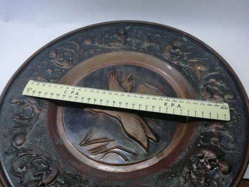 Big copper wall plate - embossed with geese and angels/cupids