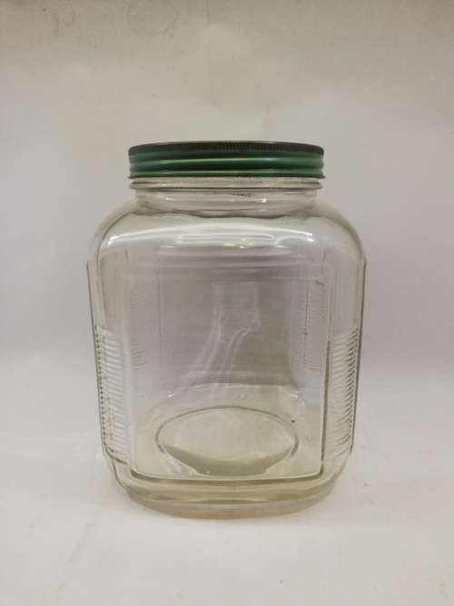 Vintage square bottle with tin lid