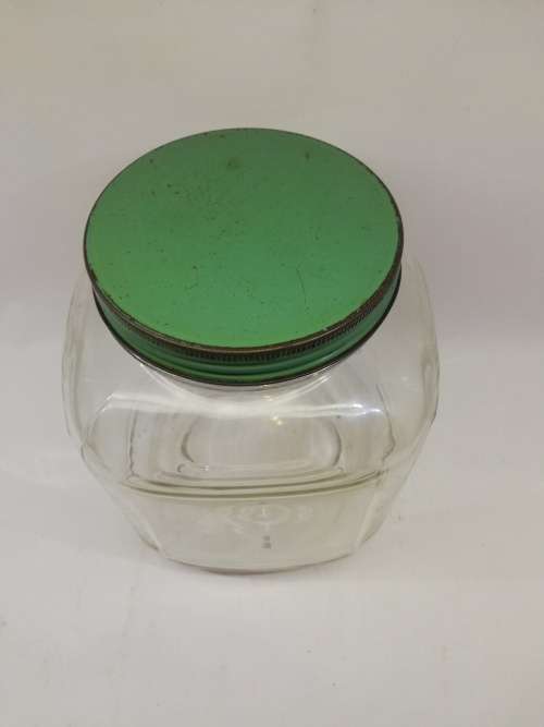 Vintage square bottle with tin lid