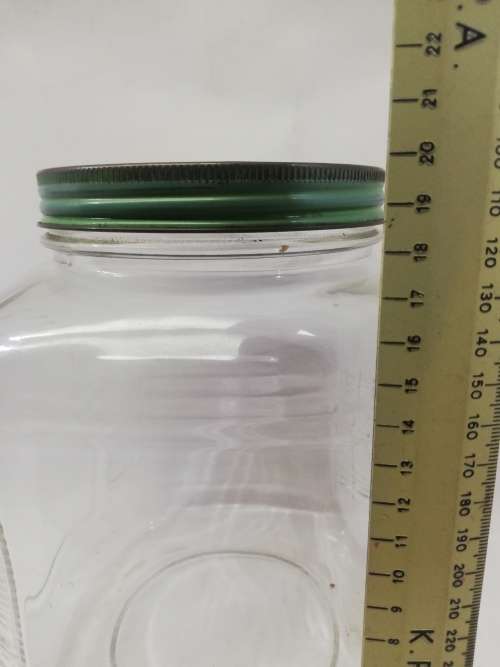 Vintage square bottle with tin lid