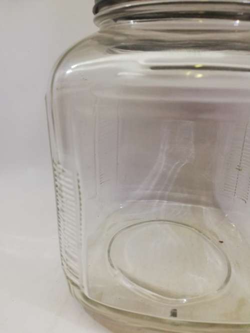 Vintage square bottle with tin lid