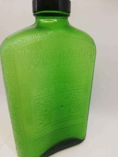 Green glass water bottle