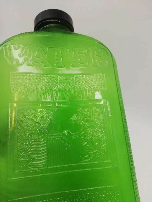 Green glass water bottle